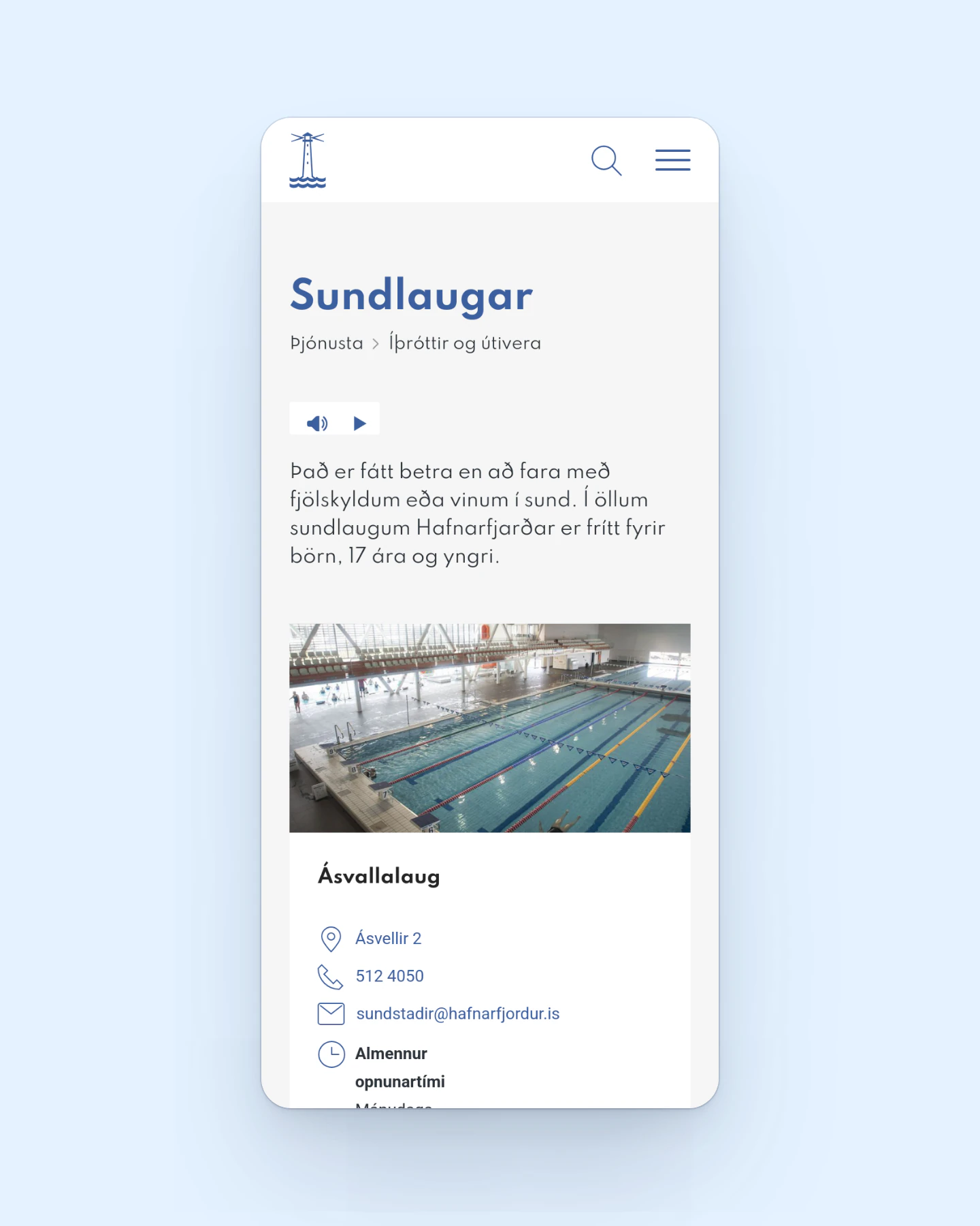 A phone screen on a pale blue background displays the Sundlaugar page of the Hafnarfjörður website. A lighthouse mark, search icon and menu button sit at the top, followed by a blue heading and a breadcrumb trail. An audio player precedes a short intro, then a photo of an indoor pool with lane ropes and contact details for Ásvallalaug.